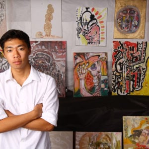 Michael Ho ’15 with his work produced at HPA, Upper School
